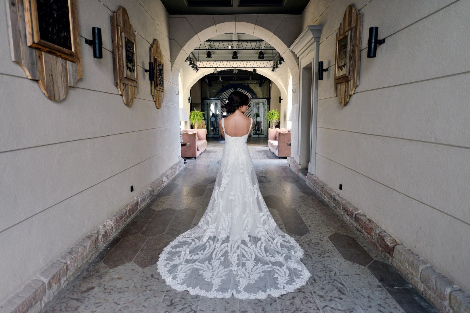 Bride in a lace bridal gown indoors