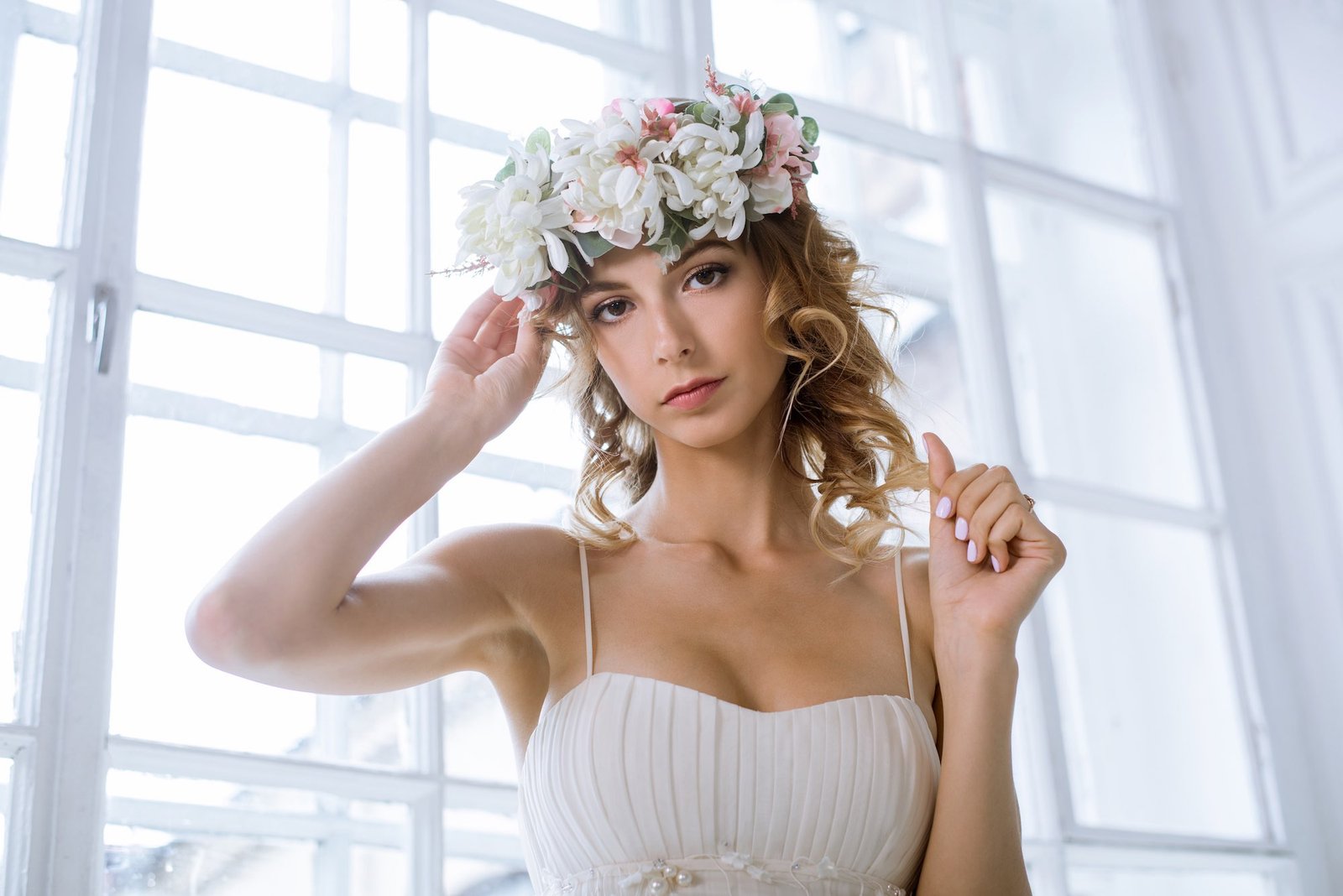 Brunette bride in a fashion wedding dress with makeup