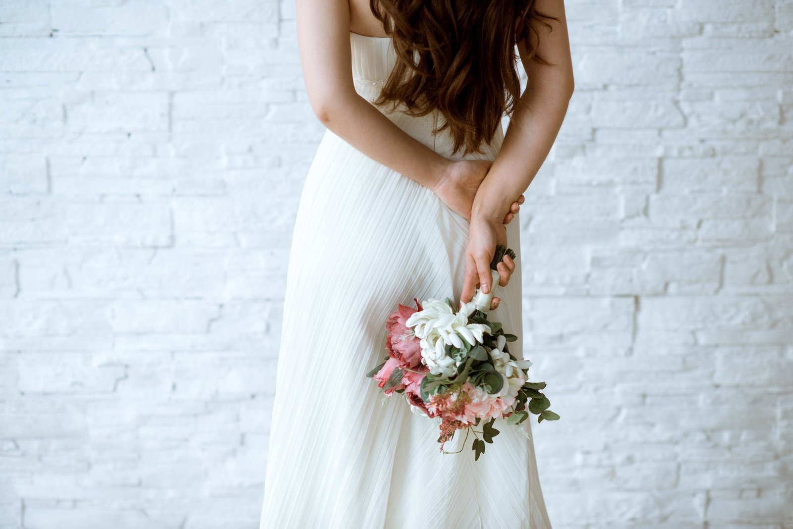 Bride holding a colourful wedding bouquet