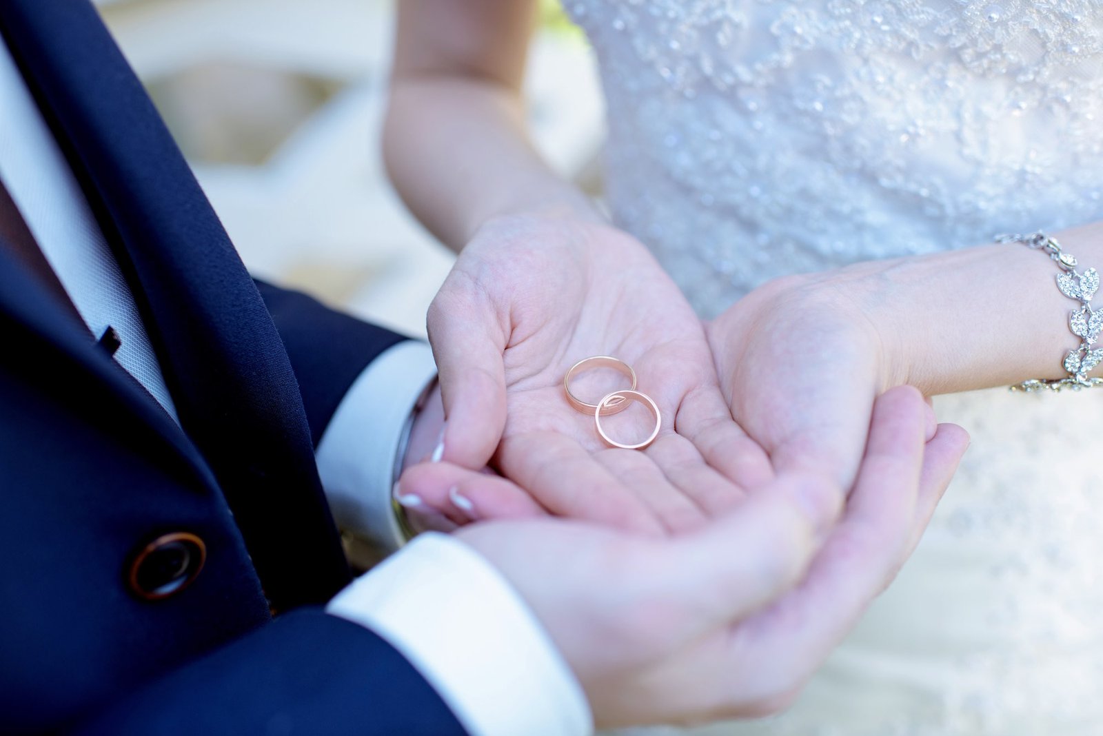 Bride and groom exchanging rings