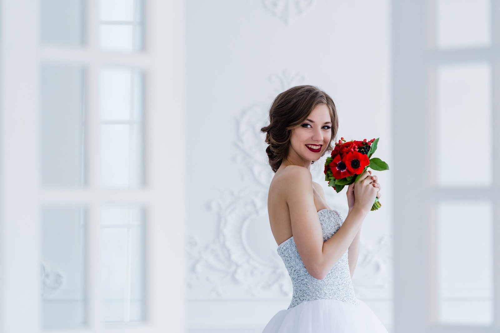 Gorgeous bride posing in a bright room