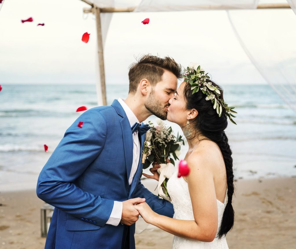 A couple kissing at their wedding reception